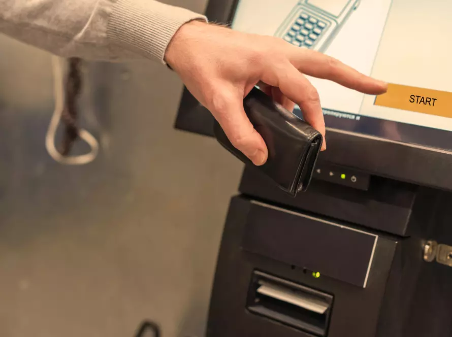 Customer using a self-service checkout