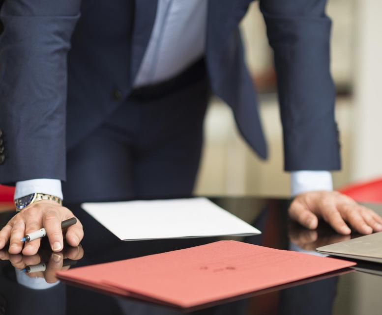 mid section of businessman s hands on office desk 2026 01 09 11 38 26 utc